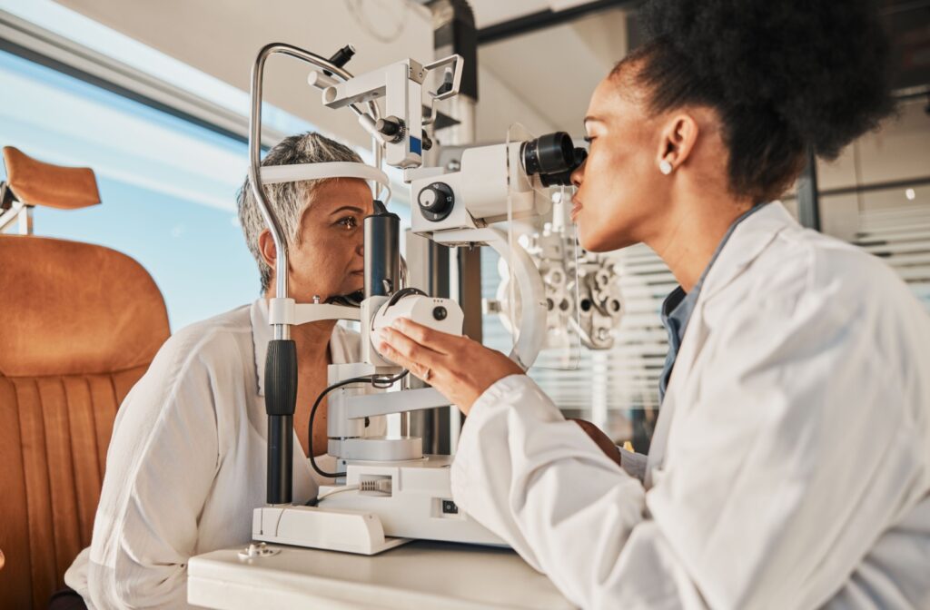 An optometrist evaluates a patient's eye health with a slit lamp during a routine eye exam.