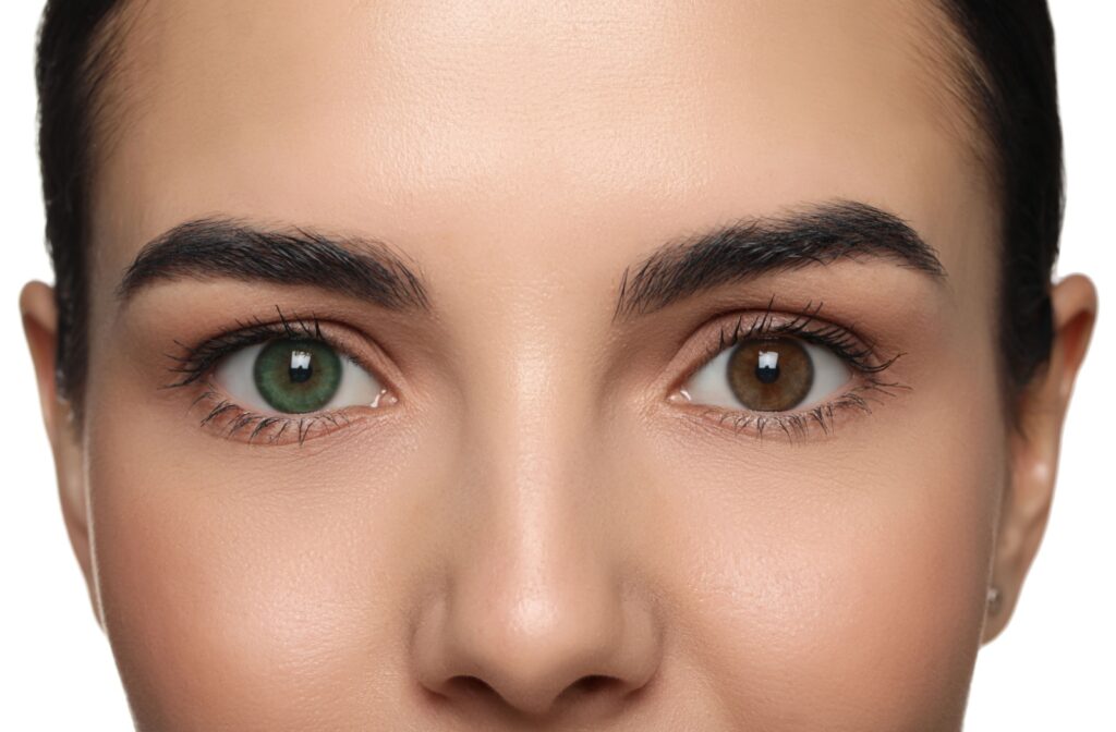 A close up of a person with one green eye and one brown eye.